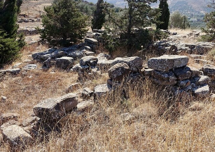 Kephala excavation site near Chondros in Viannos, Crete, with ancient stone remains and dry grass