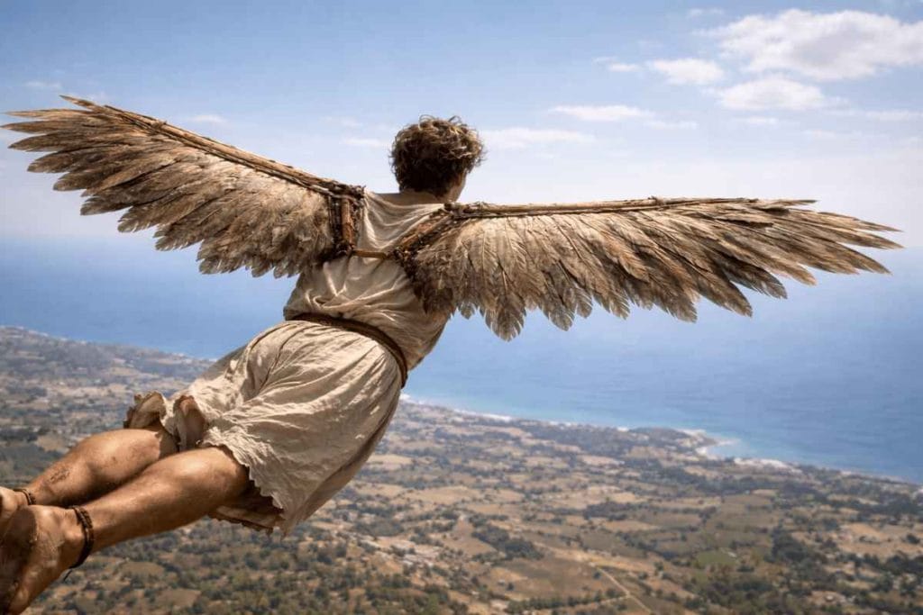 Artistic representation of Icarus soaring above the sea with feathered wings, capturing the dramatic moment from the famous Greek Myth of Icarus.